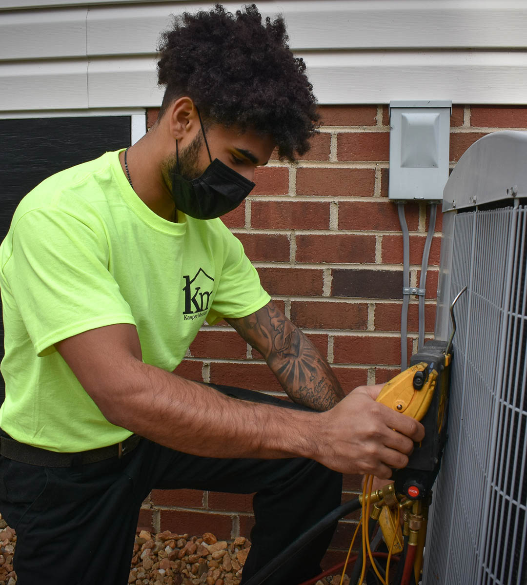 Kasper Technician checking outdoor unit Kasper Technician checking outdoor unit