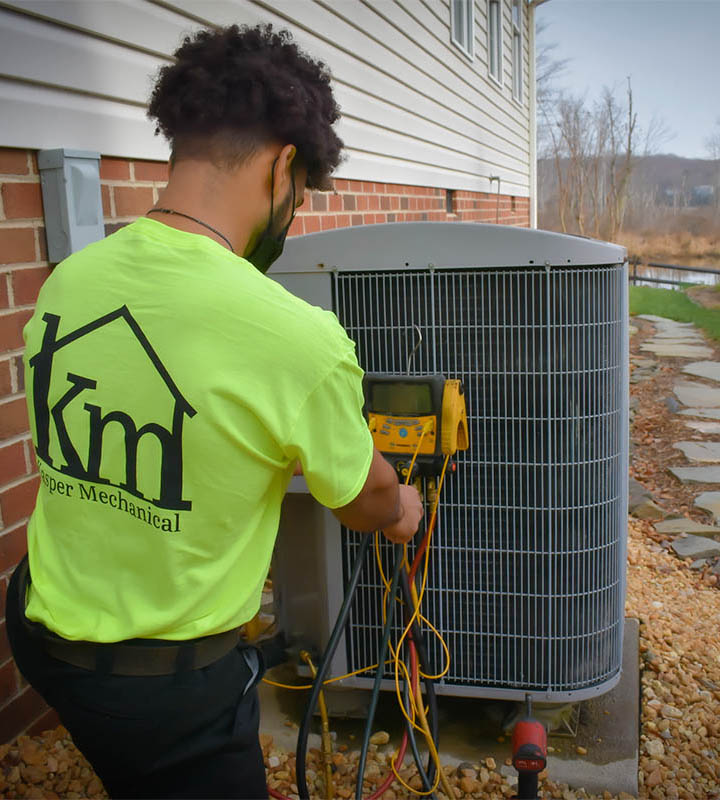 Kasper Technician checking outdoor unit Kasper Technician checking outdoor unit