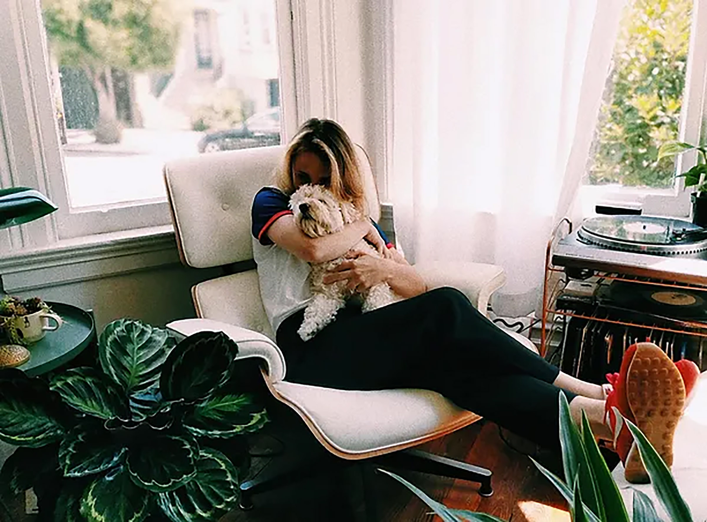 Woman and her dog enjoying indoors Woman and her dog enjoying indoors
