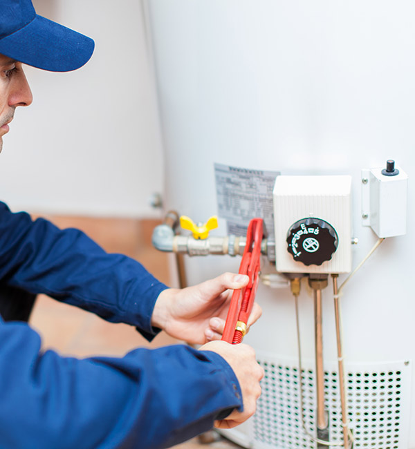 Plumber,Fixing,An,Hot-water,Heater Technician repairing water heater