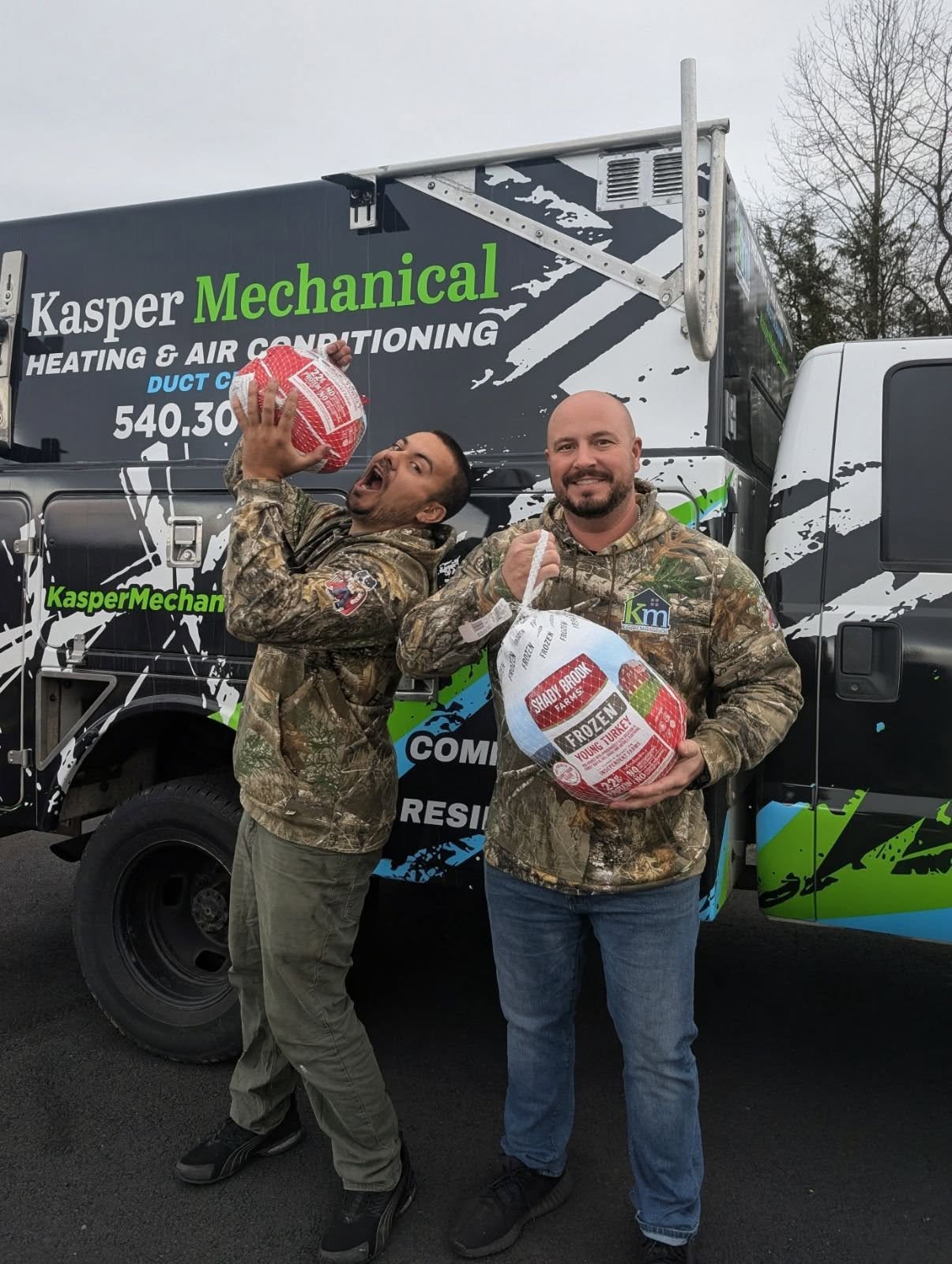 Kasper Mechanical giving away turkeys to local community members.