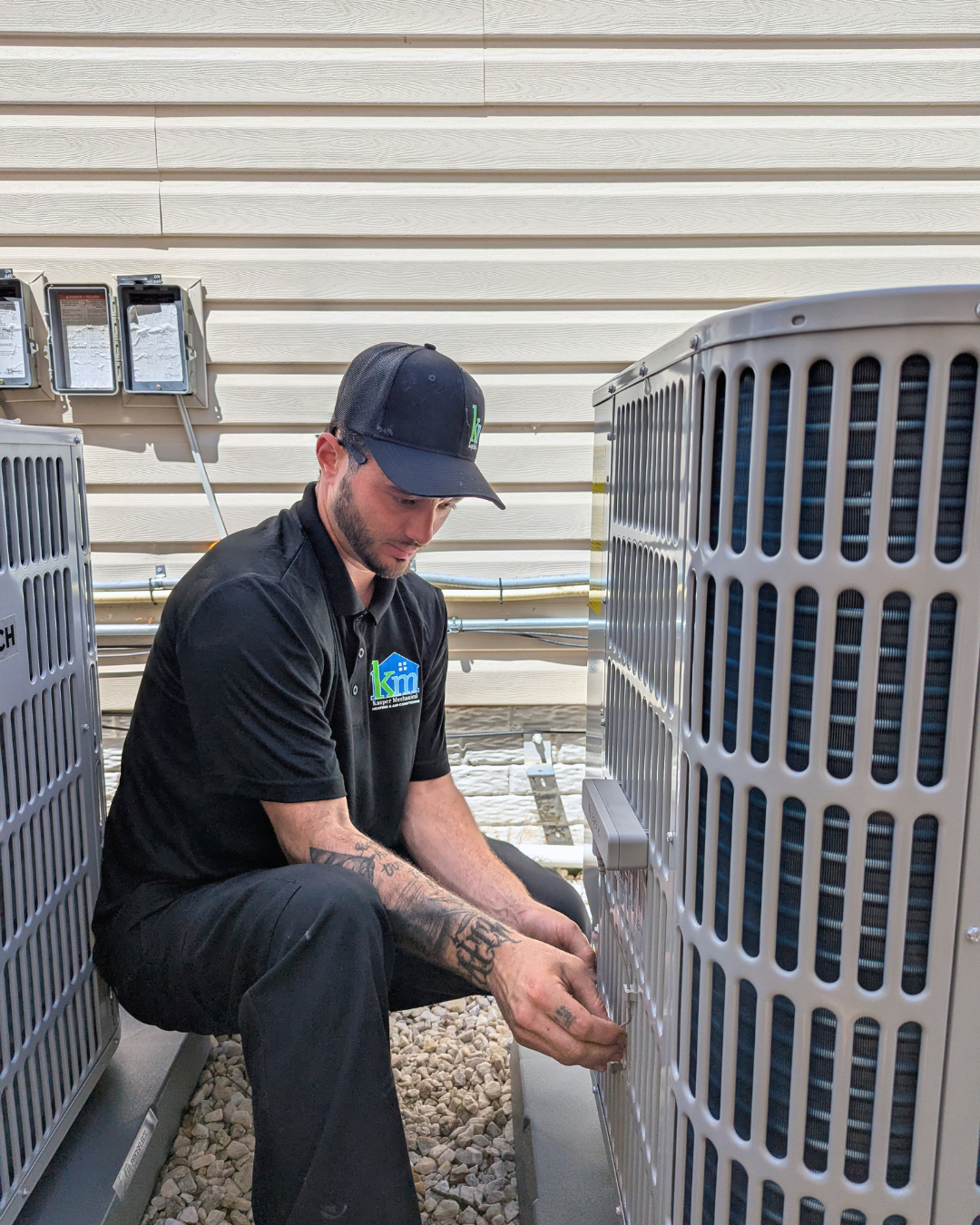 An HVAC technician installing a heat pump in Fredericksburg VA.