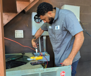 A tech repairing a cooling system.
